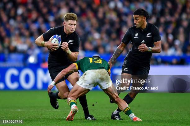 Jordie Barrett of New Zealand is tackled by Jesse Kriel of South Africa during the Rugby World Cup France 2023 Gold Final match between New Zealand...