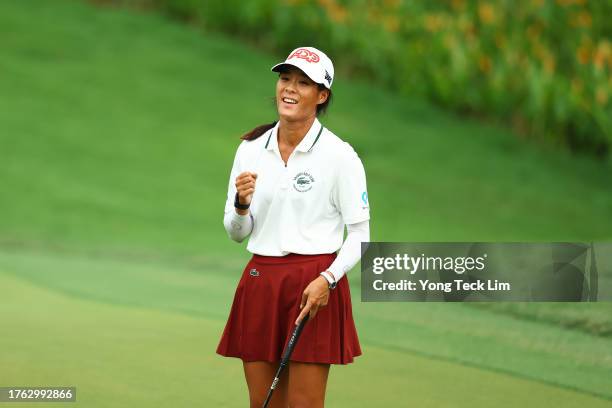 Celine Boutier of France celebrates after putt to beat Atthaya Thitikul of Thailand in a playoff ninth hole on the 15th green during the final round...