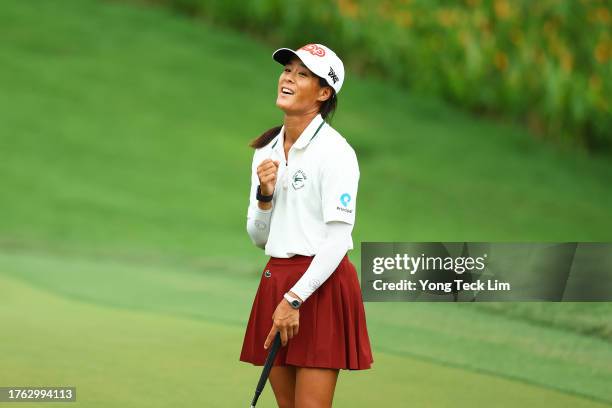 Celine Boutier of France celebrates after putt to beat Atthaya Thitikul of Thailand in a playoff ninth hole on the 15th green during the final round...