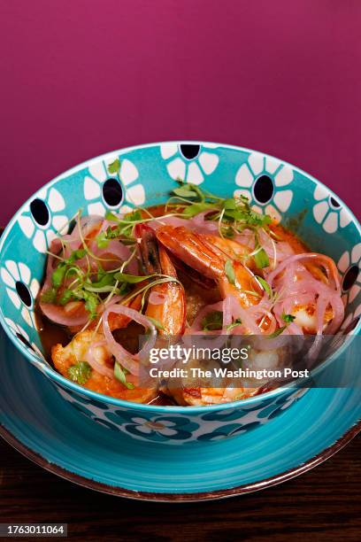 Mofongo con Camarones - fried and smashed green plantains seasoned with garlic oil, and topped with shrimp and sauteed in a tomato criollo sauce at...