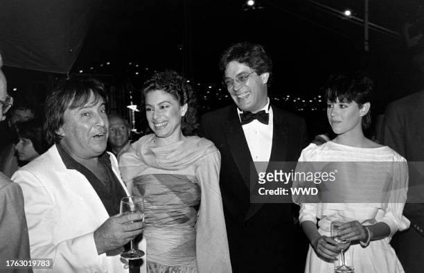 Paul Mazursky, Merel Poloway, Raul Julia, and Molly Ringwald attend a party aboard the "Peking," docked at New York City's South Street Seaport, on...