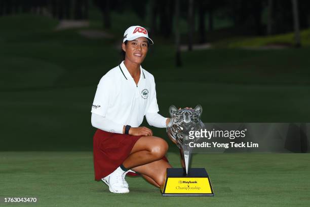 Celine Boutier of France celebrates with the trophy after winning the Maybank Championship at Kuala Lumpur Golf and Country Club on October 29, 2023...