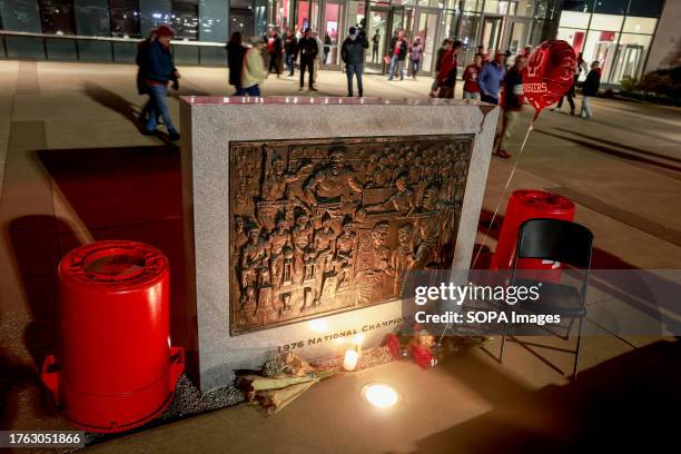 Flowers and a chair are placed at the base of the 1976 NCAA basketball championship plaque outside Simon Skjodt Assembly Hall in memory of Bob...