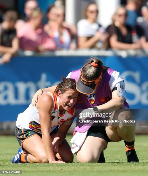 Nicola Barr of the Giants down with a shoulder injury during the 2023 AFLW Round 10 match between The Port Adelaide Power and The GWS GIANTS at...