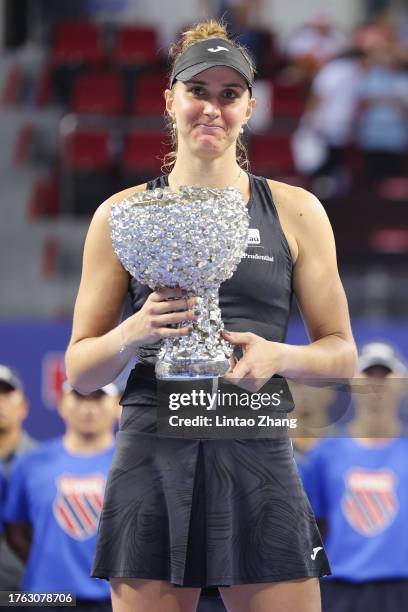 Beatriz Haddad Maia of Brazil celebrate with the trophy following her victory after winning the women's singles final matche against Qinwen Zheng of...