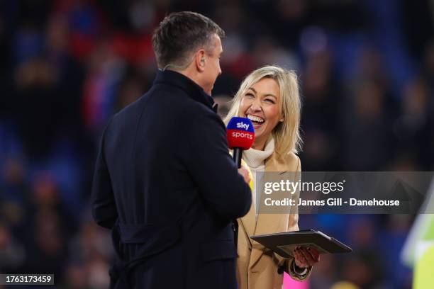 Sky Sports presenter Kelly Cates jokes with Sky Sports pundit Gary Neville during the Premier League match between Crystal Palace and Tottenham...