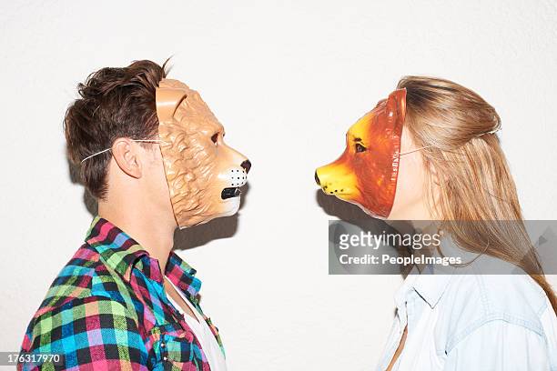 facing off with animalistic intent - party mask stockfoto's en -beelden