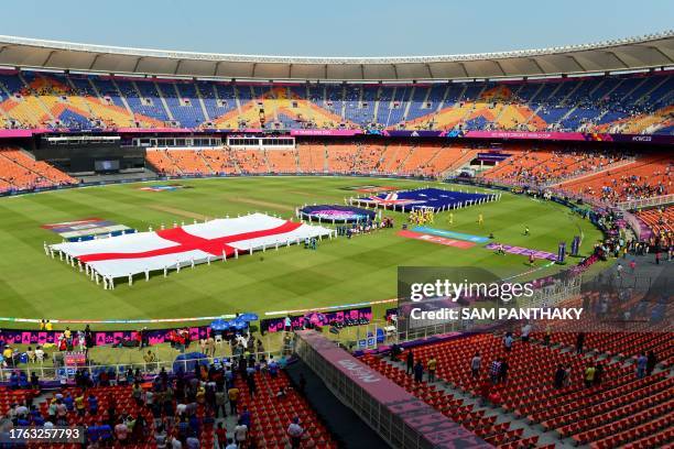 The national flags of England and Australia are displayed before the start of the 2023 ICC Men's Cricket World Cup one-day international match...