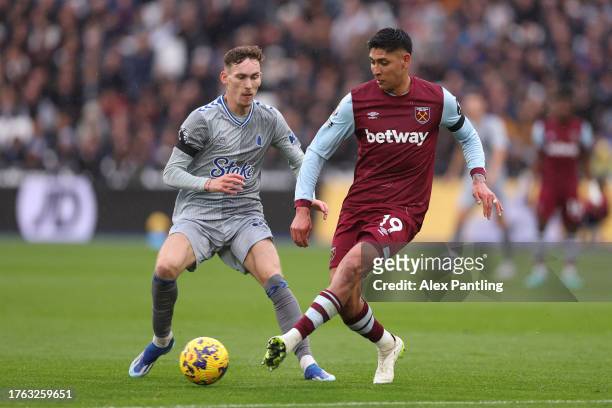 Edson Alvarez of West Ham United passes the ball whilst under pressure from James Garner of Everton during the Premier League match between West Ham...