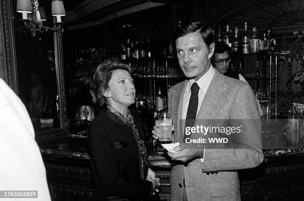 Berthe Jourdan and Louis Jourdan attend a party, celebrating the publication of Alexander Walker's "The Shattered Silents," at the Bistro restaurant...