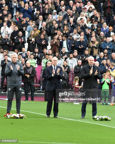 David Moyes of West Ham United, Sean Dyche of Everton and Sir Geoff Hurst join in with the applause in memory of bot Sir Bobby Charlton and Bill...