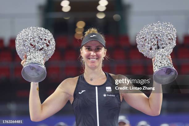 Beatriz Haddad Maia of Brazil celebrate with the two trophy following they victory of the Women's Doubles final matche against Aldila Sutjiadi of...