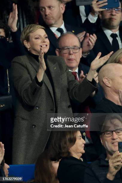 Princess Charlene of Monaco and Prince Albert II of Monaco celebrate the victory of South Africa at full time following the Rugby World Cup France...