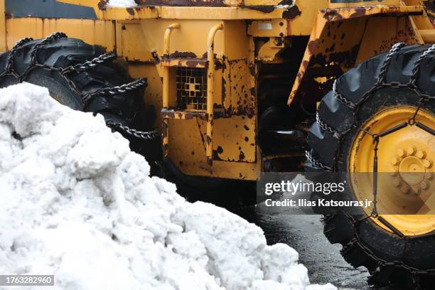 close up of snow plow machine with pile of snow on foreground - hirafu snow resort stock pictures, royalty-free photos & images