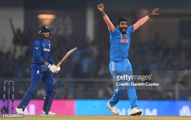 Jasprit Bumrah of India celebrates the wicket of Joe Root of England during the ICC Men's Cricket World Cup India 2023 between India and England at...