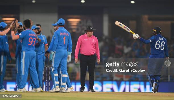 Joe Root of England makes their way off after being dismissed during the ICC Men's Cricket World Cup India 2023 between India and England at BRSABVE...