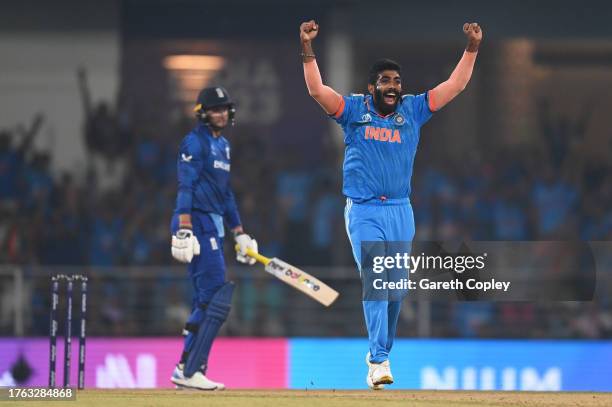 Jasprit Bumrah of India celebrates the wicket of Joe Root of England during the ICC Men's Cricket World Cup India 2023 between India and England at...