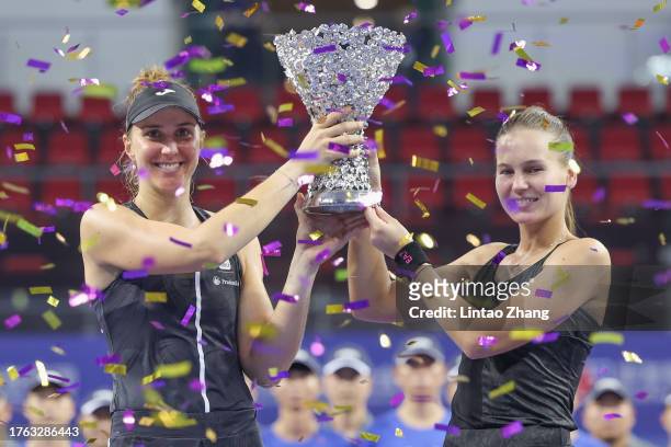 Beatriz Haddad Maia of Brazil and Veronika Kudermetova celebrate with the trophy following they victory of the women's doubles final matche against...