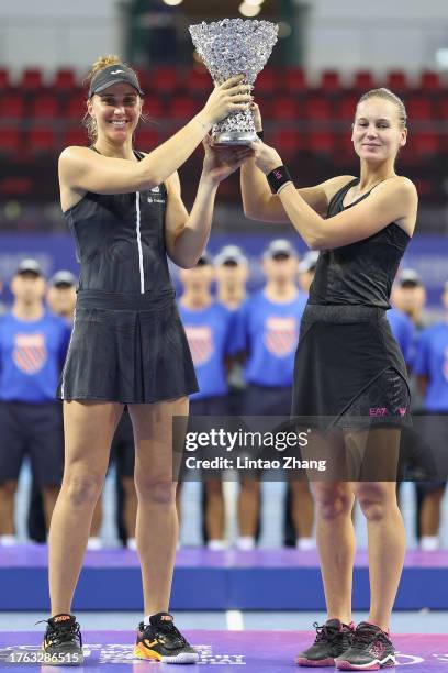 Beatriz Haddad Maia of Brazil and Veronika Kudermetova celebrate with the trophy following they victory of the women's doubles final matche against...