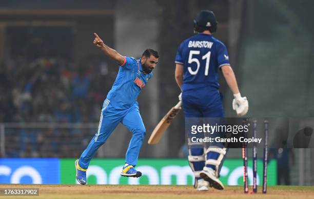 Mohammed Shami of India celebrates the wicket of Jonny Bairstow of England during the ICC Men's Cricket World Cup India 2023 between India and...