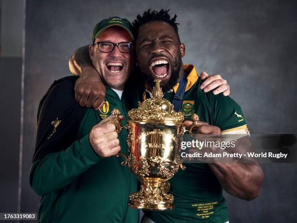 Jacques Nienaber, Head Coach of South Africa and Siya Kolisi of South Africa pose with the Webb Ellis Cup during the South Africa Winners Portrait...