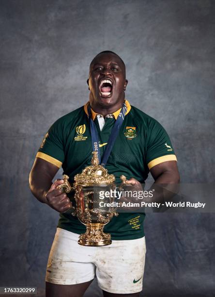Trevor Nyakane of South Africa poses with the Webb Ellis Cup during the South Africa Winners Portrait shoot after the Rugby World Cup Final match...