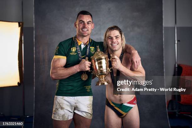 Jesse Kriel and Faf De Klerk of South Africa pose with the Webb Ellis Cup during the South Africa Winners Portrait shoot after the Rugby World Cup...