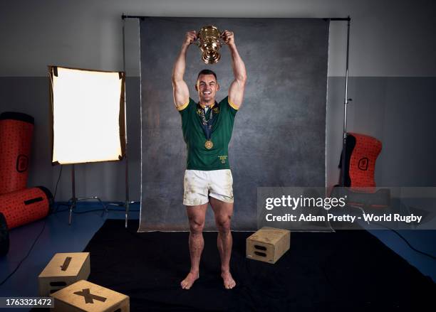 Jesse Kriel of South Africa poses with the Webb Ellis Cup during the South Africa Winners Portrait shoot after the Rugby World Cup Final match...