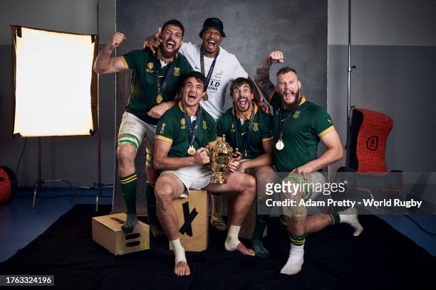 Jean Kleyn, Marvin Orie, Franco Mostert, Eben Etzebeth and RG Snyman of South Africa pose with the Webb Ellis Cup during the South Africa Winners...