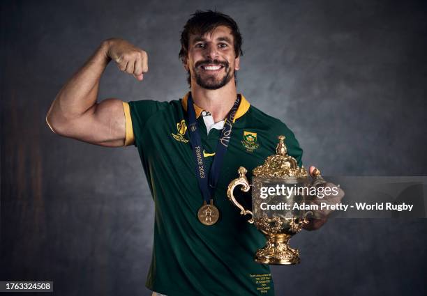 Eben Etzebeth of South Africa poses with the Webb Ellis Cup during the South Africa Winners Portrait shoot after the Rugby World Cup Final match...