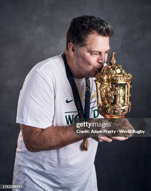 Rassie Erasmus, Coach of South Africa, poses with the Webb Ellis Cup during the South Africa Winners Portrait shoot after the Rugby World Cup Final...