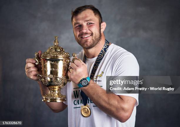 Duane Vermeulen of South Africa poses with the Webb Ellis Cup during the South Africa Winners Portrait shoot after the Rugby World Cup Final match...