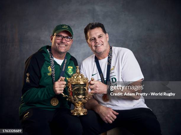 Jacques Nienaber, Head Coach of South Africa, and Rassie Erasmus, Coach of South Africa, pose with the Webb Ellis Cup during the South Africa Winners...
