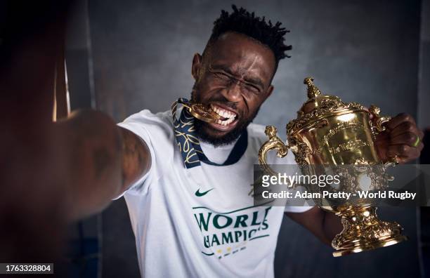 Siya Kolisi of South Africa poses with the Webb Ellis Cup during the South Africa Winners Portrait shoot after the Rugby World Cup Final match...