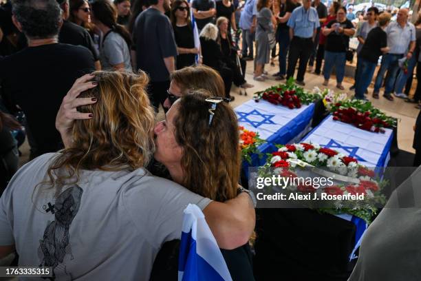 The immediate family of Lili Itamari and Ram Itamari grieve during the funeral after the couple from Kibbutz Kfar Aza who were killed when Hamas...
