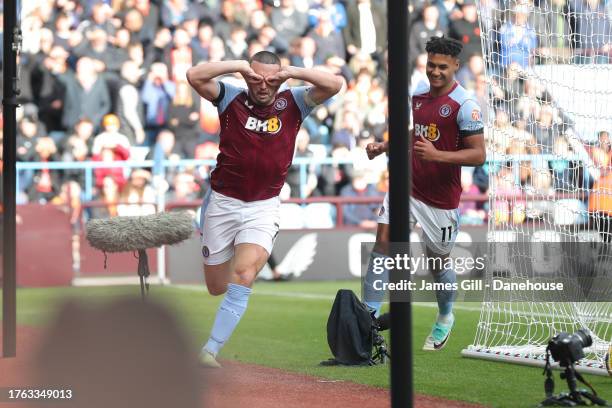 John McGinn of Aston Villa celebrates after scoring his side's first goal during the Premier League match between Aston Villa and Luton Town at Villa...