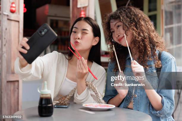 friendship selfies together after eat - photo messaging stock pictures, royalty-free photos & images