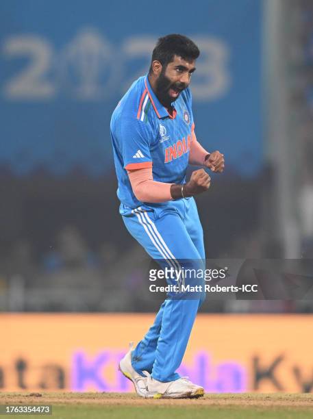 Jasprit Bumrah of India celebrates the wicket of Mark Wood of England during the ICC Men's Cricket World Cup India 2023 between India and England at...