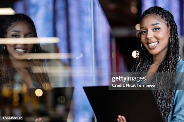 motivate gen z employees with emotional intelligence with self-actualization. portrait of a businesswoman or software developer using a laptop computer in a tech business office. - self actualization stock pictures, royalty-free photos & images