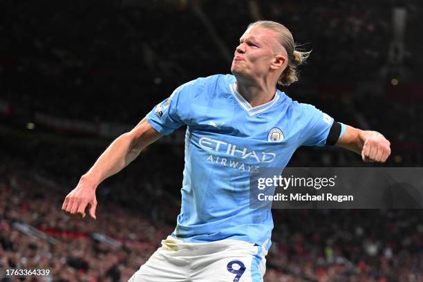 Erling Haaland of Manchester City celebrates after scoring the team's first goal from a penalty kick during the Premier League match between...