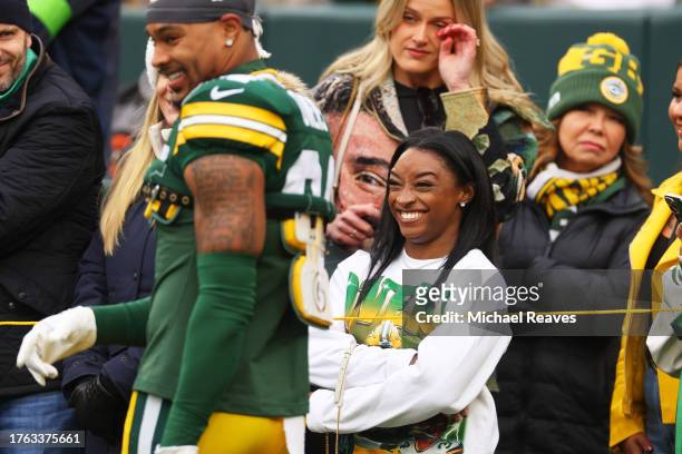 Simone Biles looks on prior to a game between the Minnesota Vikings and the Green Bay Packers at Lambeau Field on October 29, 2023 in Green Bay,...