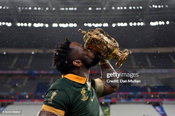 Siya Kolisi of South Africa celebrates with the The Webb Ellis Cup following his side's victory in the Rugby World Cup France 2023 Gold Final match...