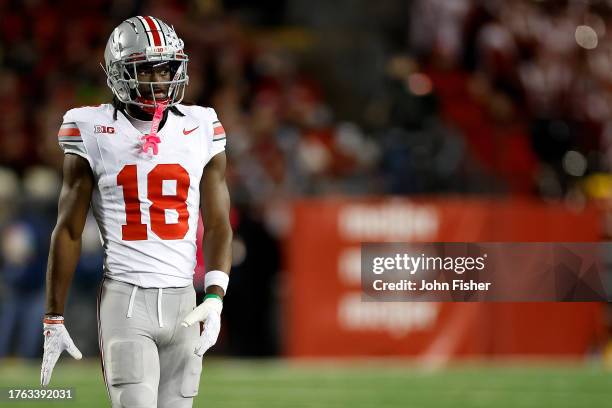 Marvin Harrison Jr. #18 of the Ohio State Buckeyes looks on during the game against the Wisconsin Badgers at Camp Randall Stadium on October 28, 2023...