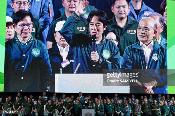 Large screen shows Lai Ching-te , presidential candidate for 2024 from the ruling Democratic Progressive Party , gesturing during a campaign rally in...