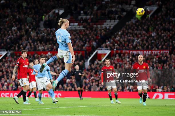 Erling Haaland of Manchester City scores the team's second goal during the Premier League match between Manchester United and Manchester City at Old...