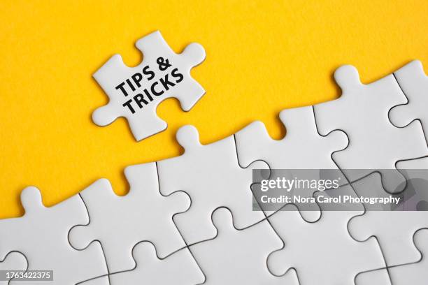 tips and tricks text on jigsaw puzzle - tips and tricks stock pictures, royalty-free photos & images
