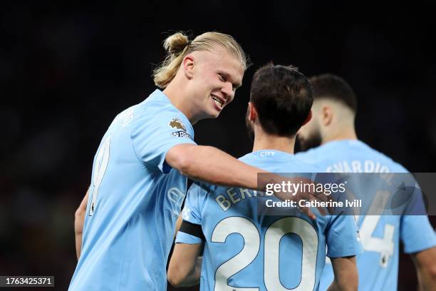 Erling Haaland of Manchester City celebrates with teammate Bernardo Silva after scoring the team's second goal during the Premier League match...