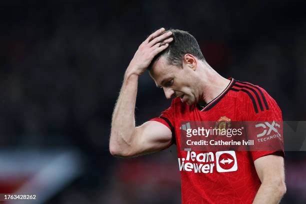 Jonny Evans of Manchester United looks dejected after Erling Haaland of Manchester City scores his team's second goal during the Premier League match...