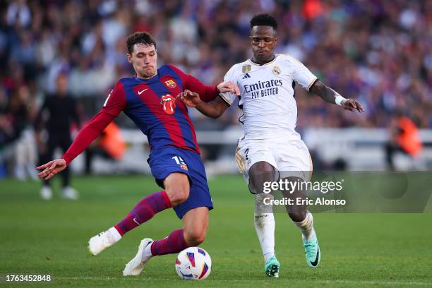 Andreas Christensen of FC Barcelona challenges for the ball against Vinicius Junior of Real Madrid during the LaLiga EA Sports match between FC...