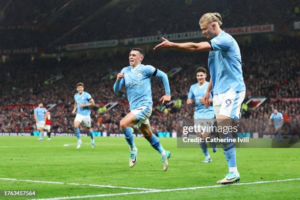 Phil Foden of Manchester City celebrates alongside teammate Erling Haaland after scoring the team's third goal during the Premier League match...